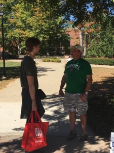 Andy Schmelzer reasoning with a Marshall University student